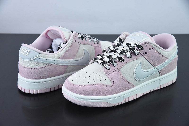 the nike dunk low appears in pink and grey suede dv3054-600